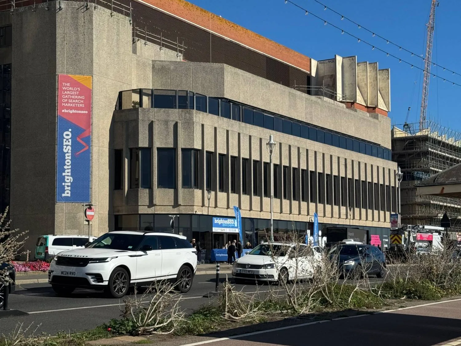 The Brighton Centre on the seafront with a BrightonSEO banner reading 